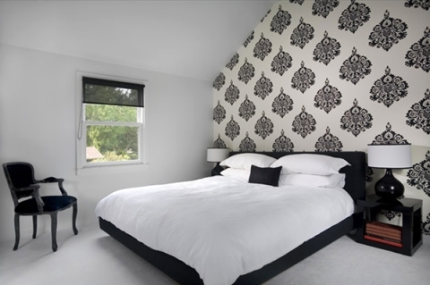 Black wallpaper in the bedroom interior