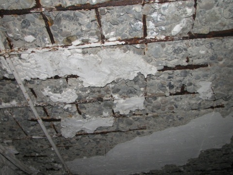 Corrosion of steel reinforcement provokes the destruction of the protective layer of concrete