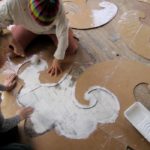 Giving the surface of the old floor originality: using DIY cardboard stencils