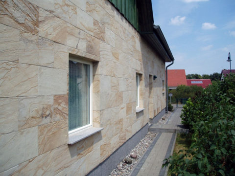 Facade decorated with stone wallpaper