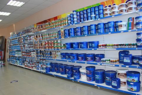 Water-based paints in the window of a building materials store