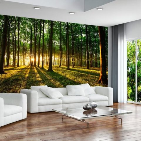 The atmosphere of warmth and comfort is achieved due to the natural wooden flooring and the natural landscape on the photo wallpaper