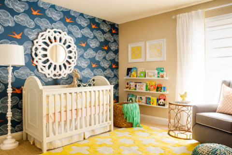 The deep dark blue color of the wallpaper near the crib will set the child to sleep