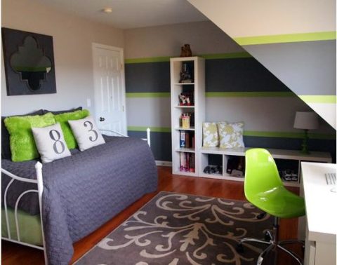 Wide stripes on the wallpaper in a small room of a boy make it more spacious