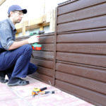 metal siding under a log photo